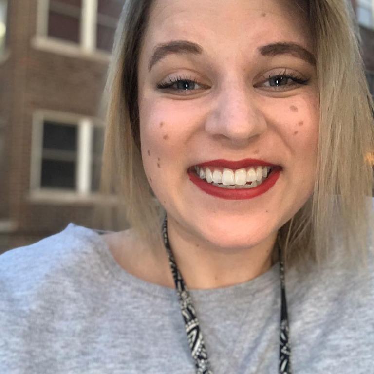 Extreme close-up of Hannah Lugo's smiling face.