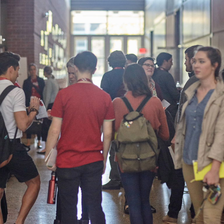 Large group of Herron School of Art and Design students in the Grand Hall of Eskenazi Hall milling about at a career fair